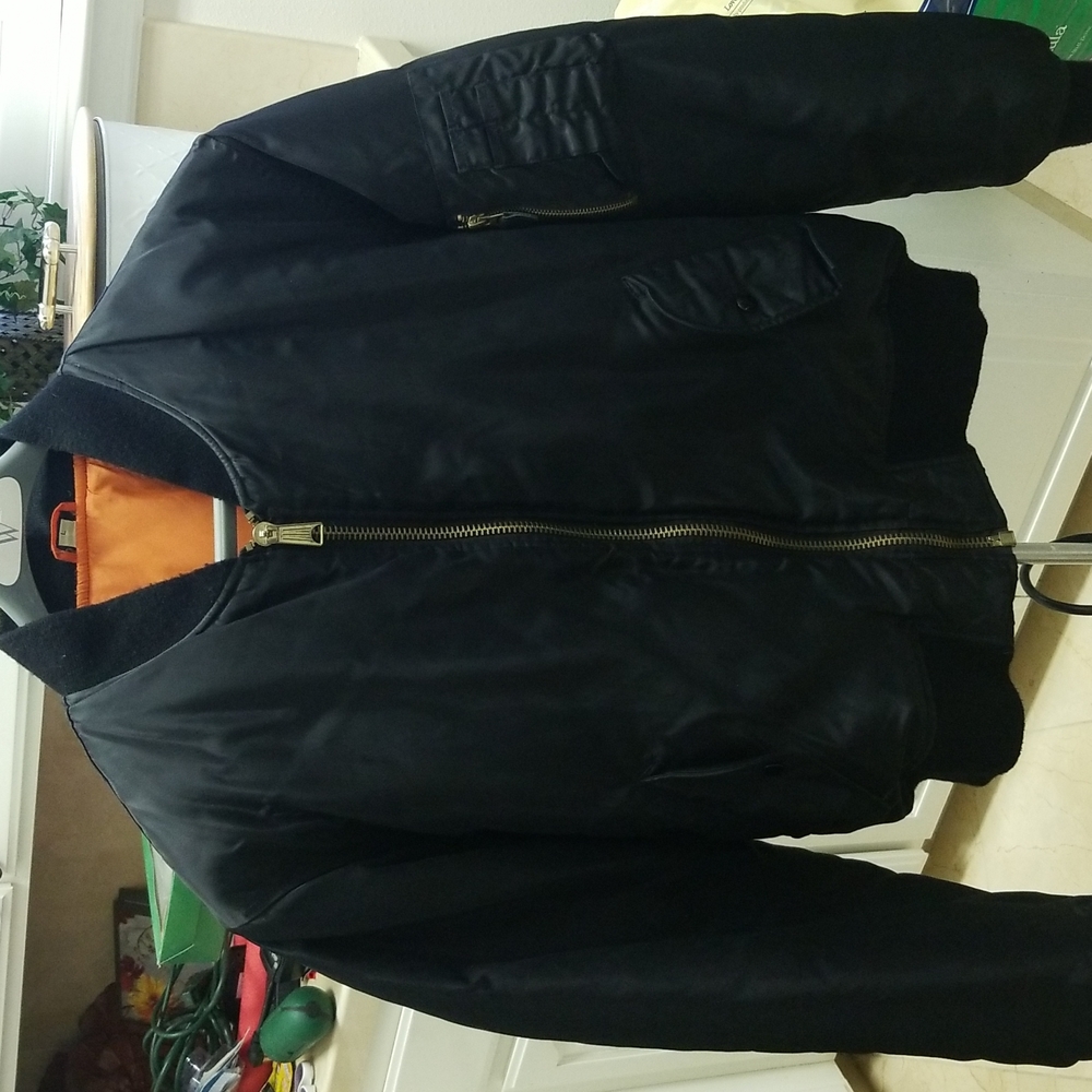 Black men's puffer zip up jacket.